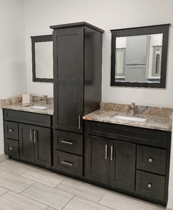 Dark wood double bathroom vanity with center storage cabinet
