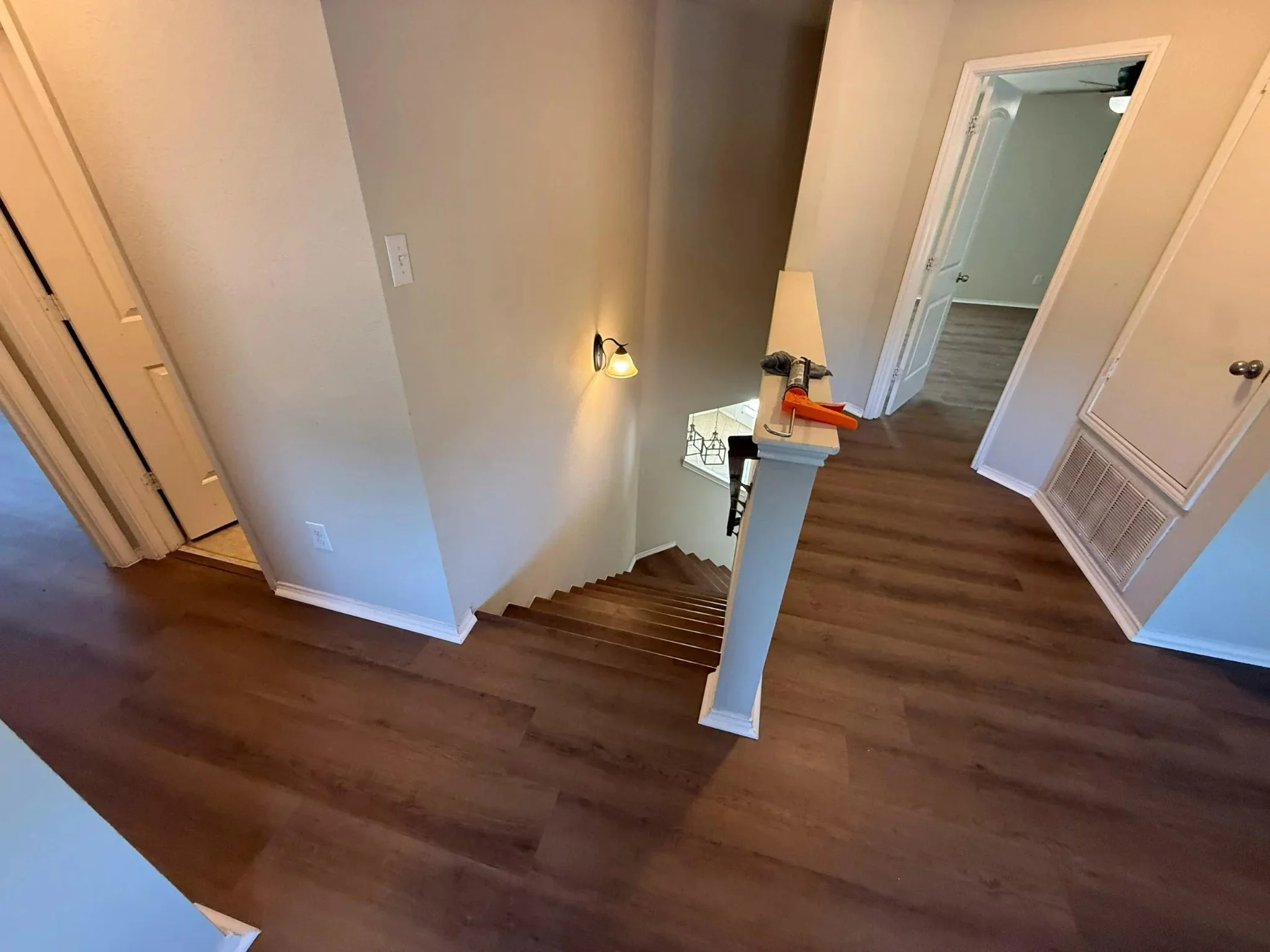 Upstairs landing with dark walnut plank flooring