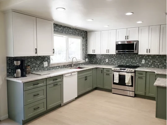 Jade Green Shaker kitchen cabinetry with white uppers and mosaic backsplash