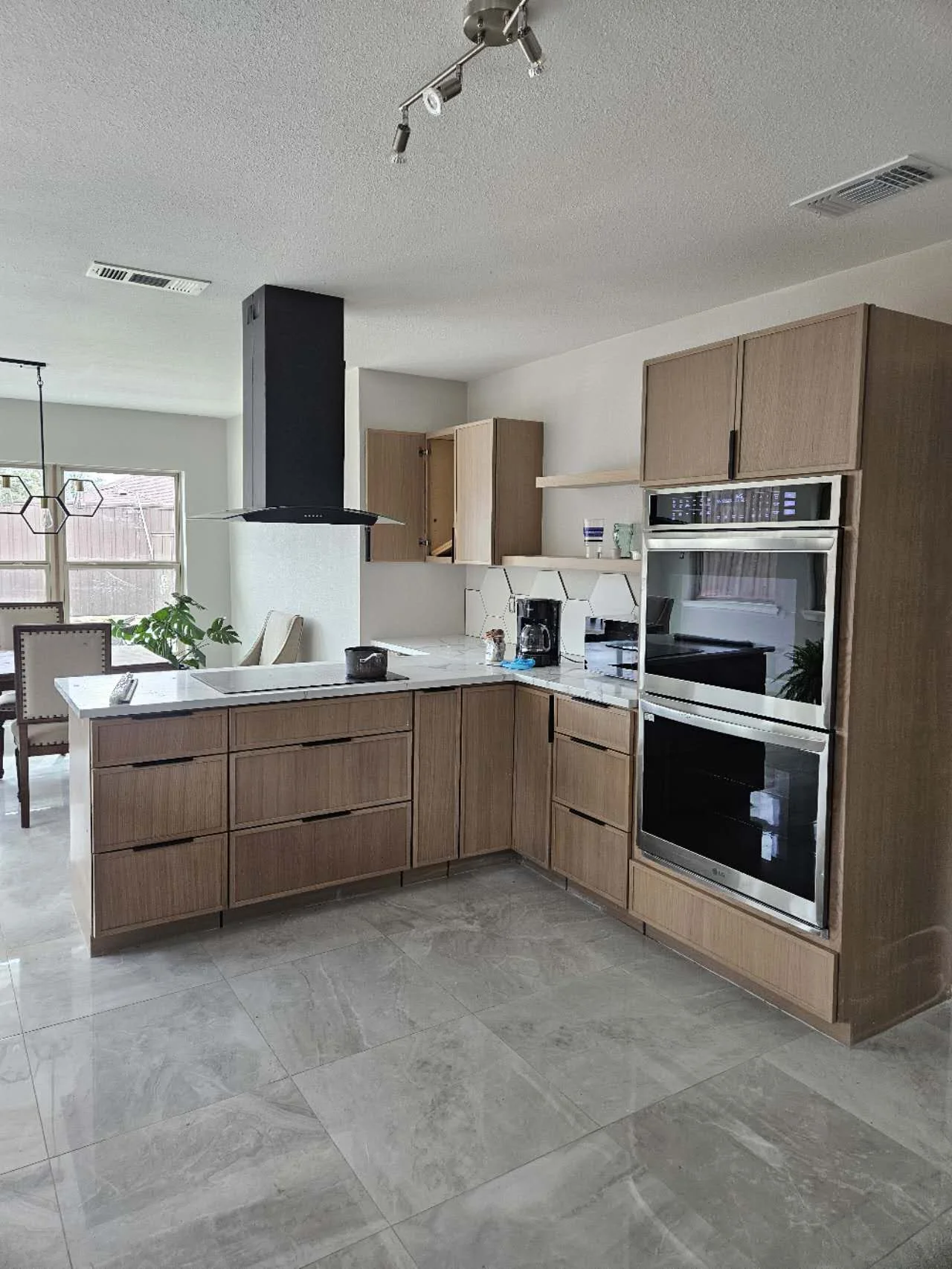 Wood-tone slim shaker kitchen cabinetry