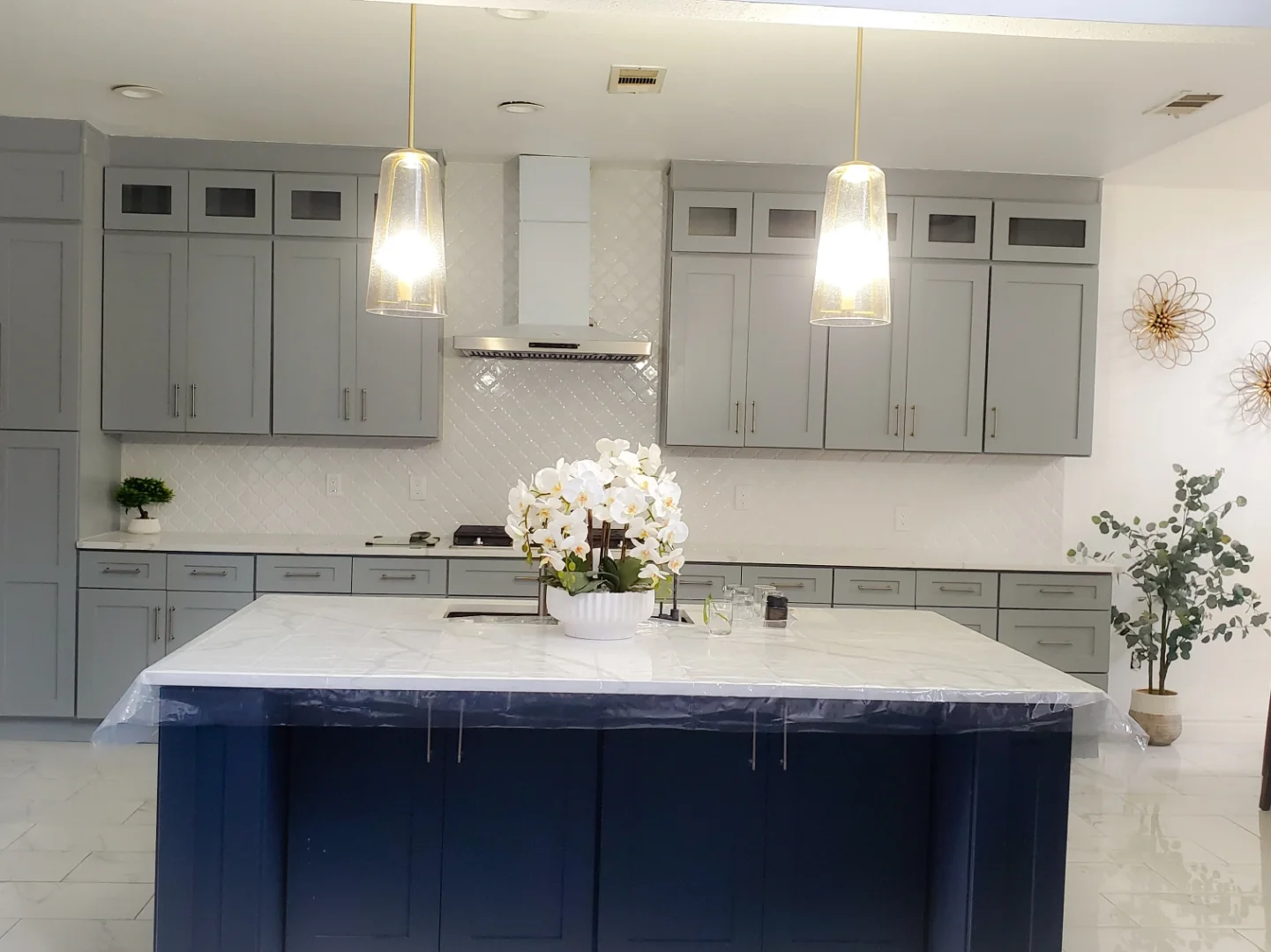 Two-tone blue and gray shaker kitchen cabinetry