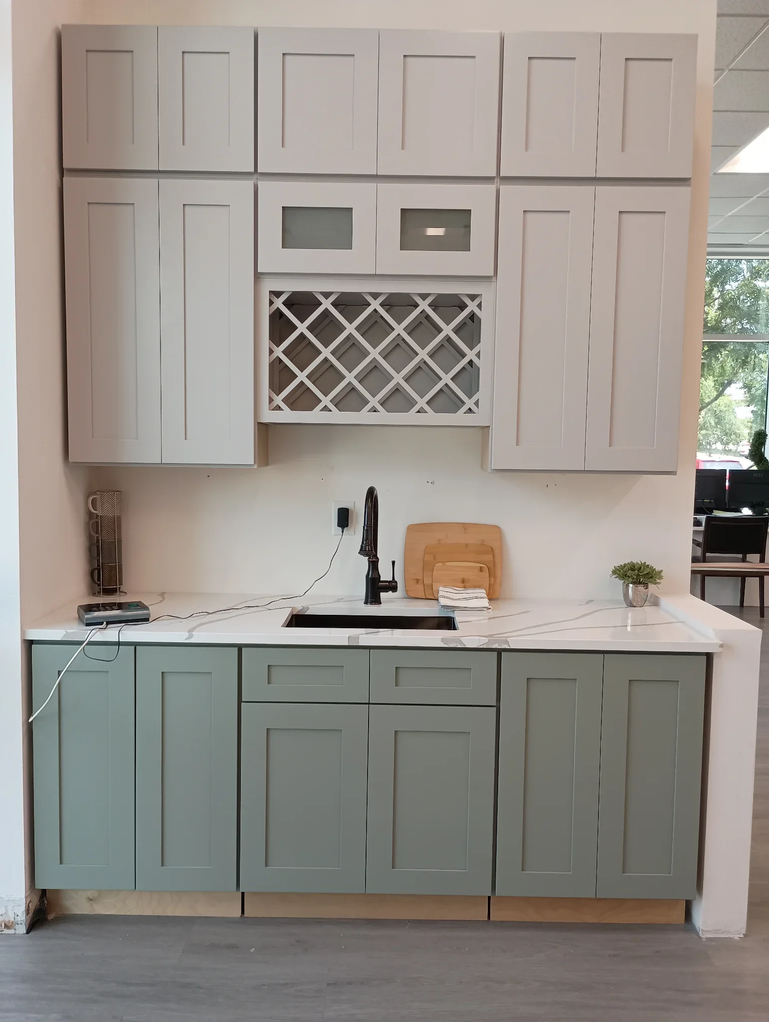 Grey and sage green cabinet display with wine rack storage