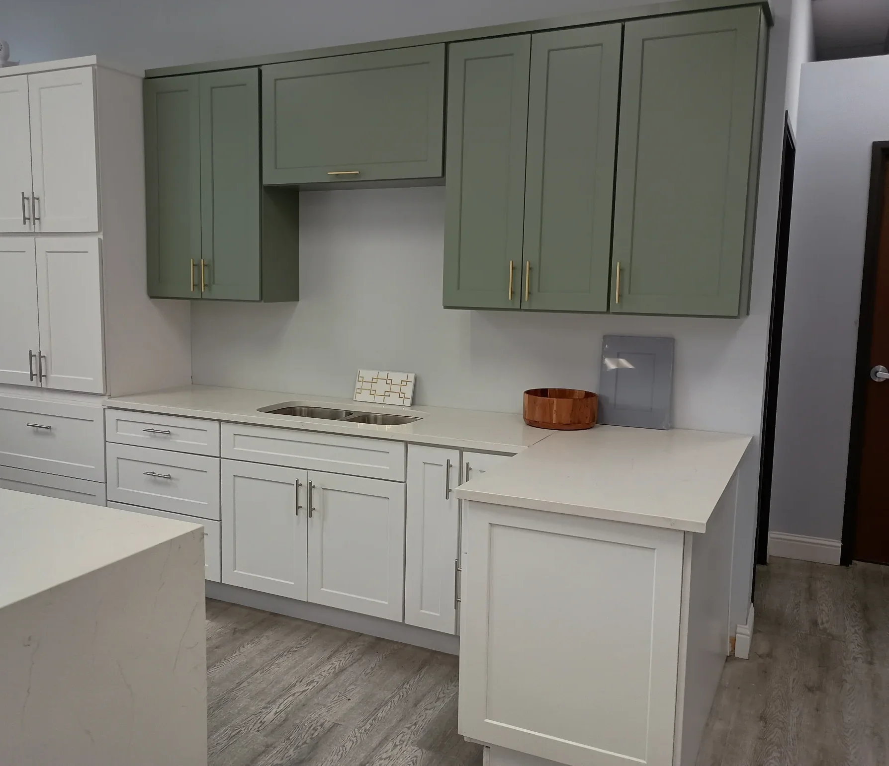 Sage green and white cabinet display