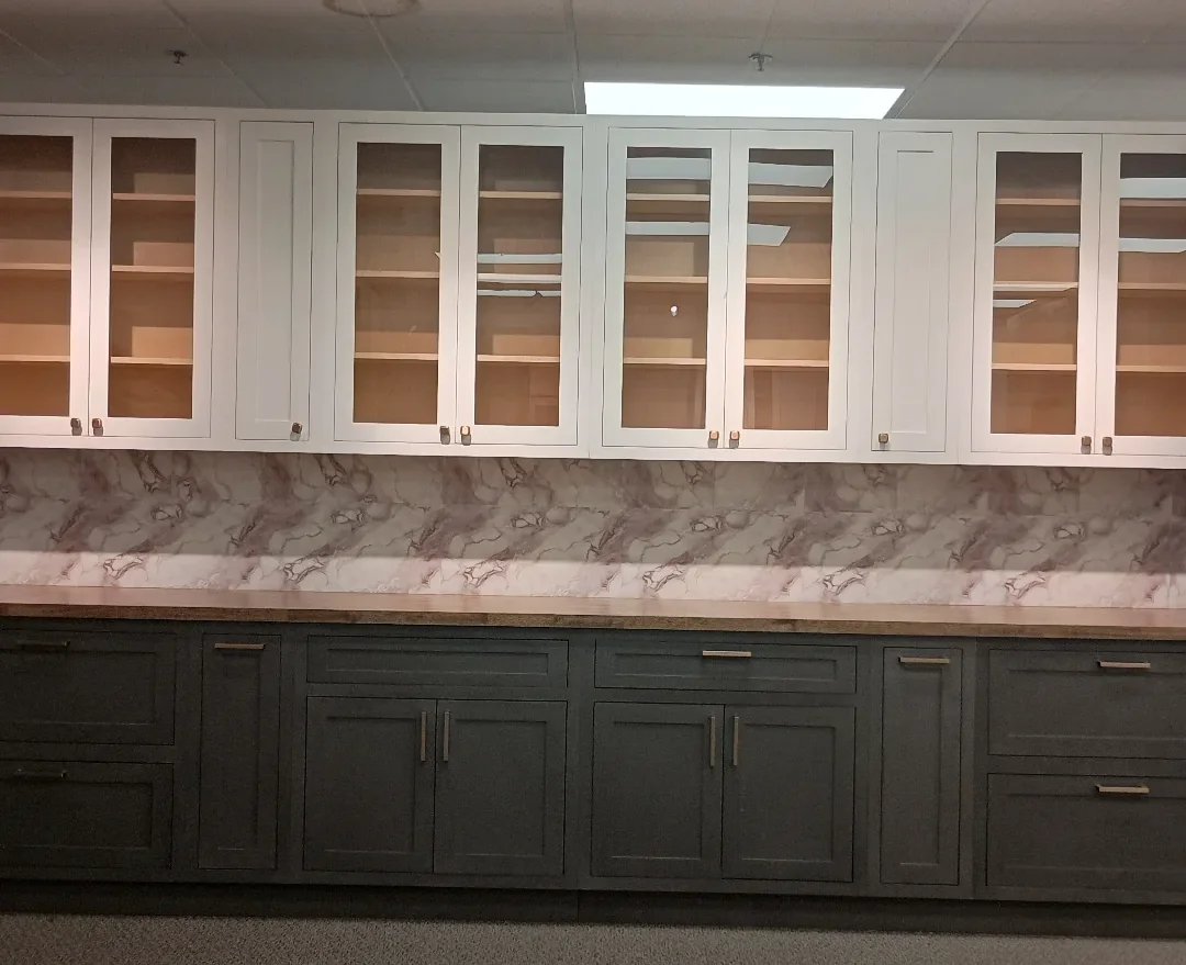 White glass-front and dark green cabinet display