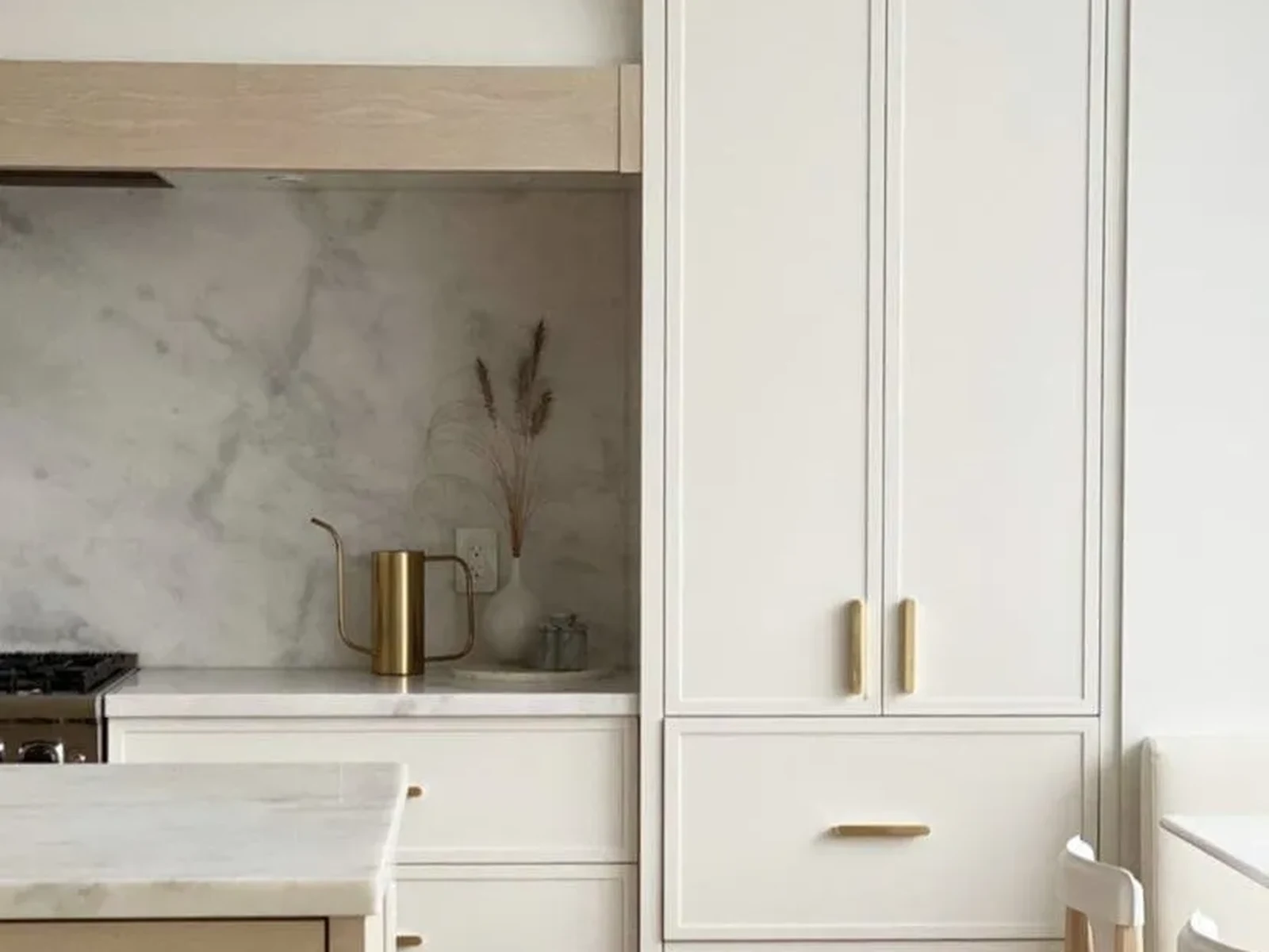 Slim Shaker White tall pantry cabinet with brass hardware